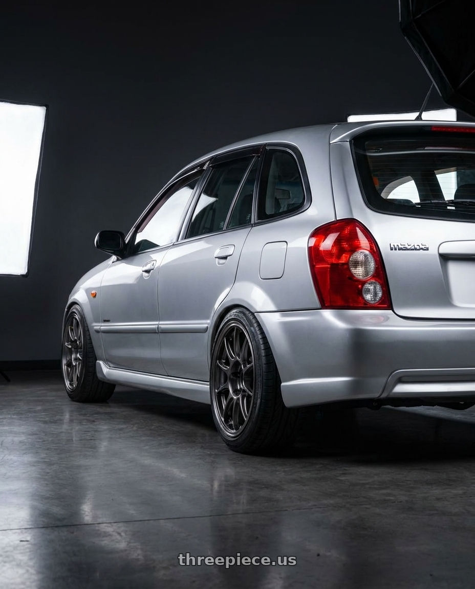2007 mazda protege5 with WedsSport TC105X 4x100 15x8.0+35 EJ Titan wheels rear three quarter view extreme stretch tires
