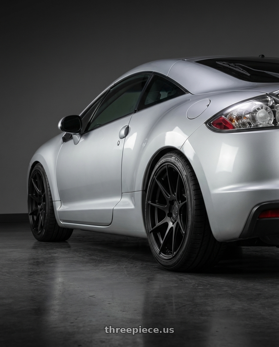 2010 Mitsubishi Eclipse with Aodhan AH09 5x114.3 18x8.5 +35 Matte Black wheels rear three quarter view square tires
