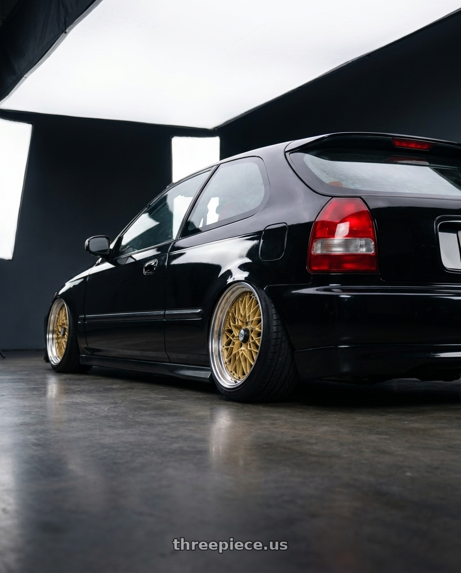 2000 honda civic hatchback with SSR Formula MESH 4X100 16X7+39 SL Disk Fm Gold wheels rear three quarter view slight stretch tires