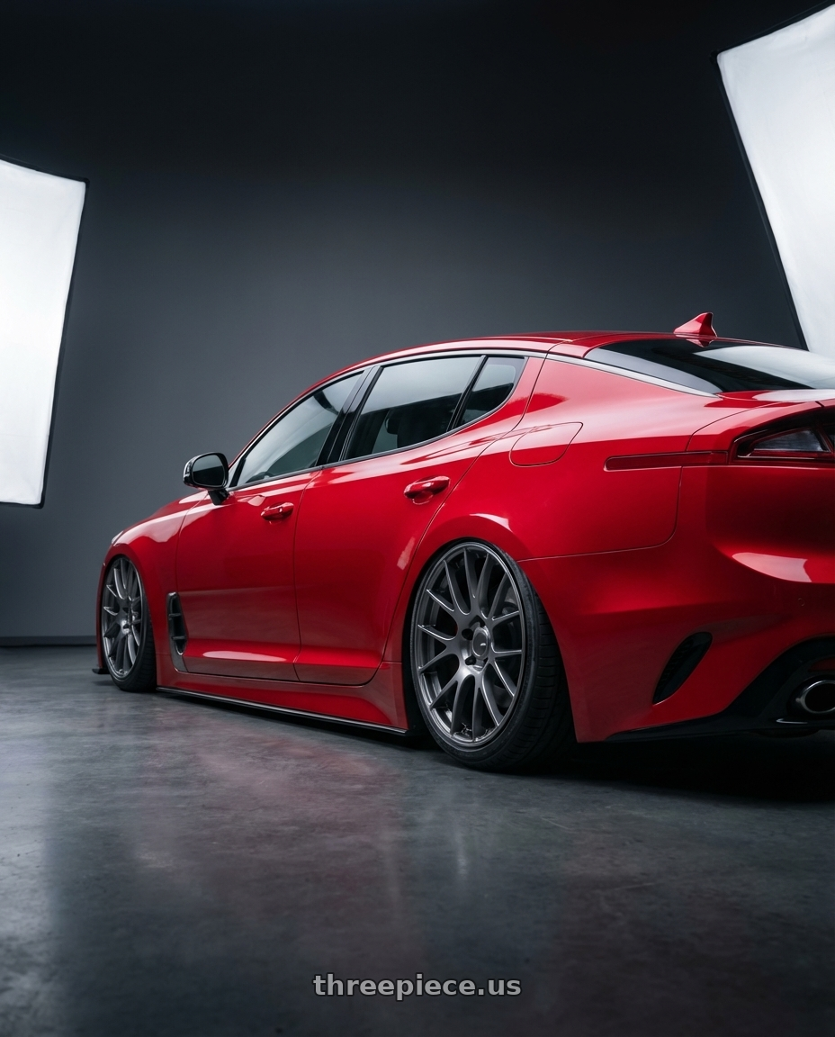 2022 Kia Stinger GT with Ssr Gtv04 5x114.3 19×8.5x8.5+38  METALLIC GRAY wheels rear three quarter view slight stretch tires