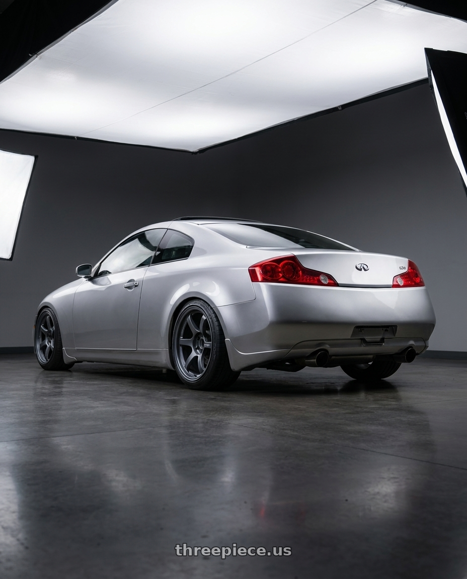 2005 infiniti g35 coupe, silver with Gram Lights 57DR 5x114.3 18x9.5+12 Gunblue II wheels rear three quarter view slight stretch tires