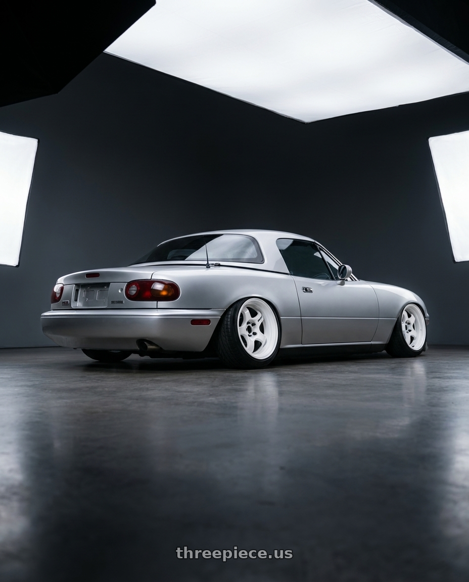 1991 mazda miata with Work Meister S1 2P 4x100 15x8+38 A Disk Black wheels rear three quarter view slight stretch tires
