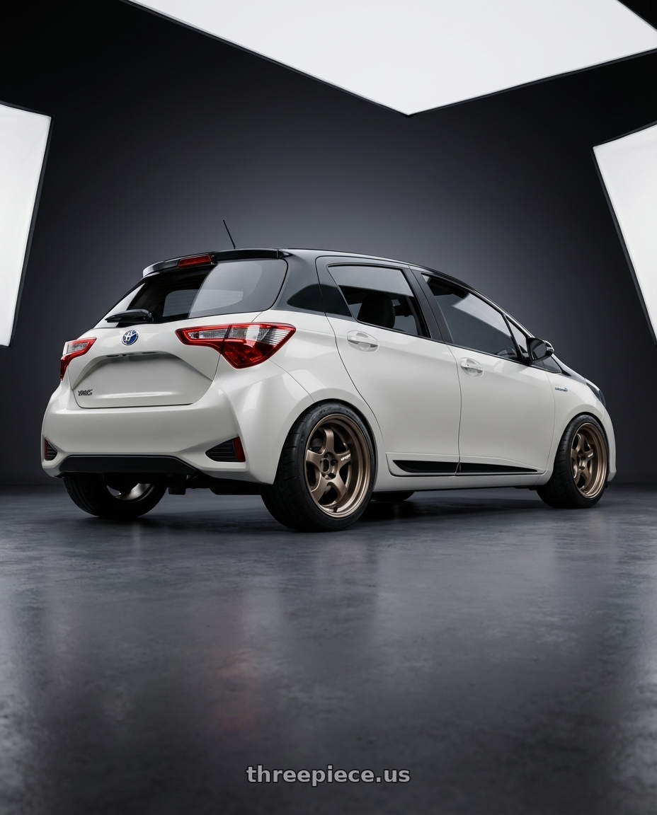 2020 Toyota Yaris Y20 with Work Meister S1R 4x100 16x7.5+12 A Disk Ashdot Titanium wheels rear three quarter view meaty tires
