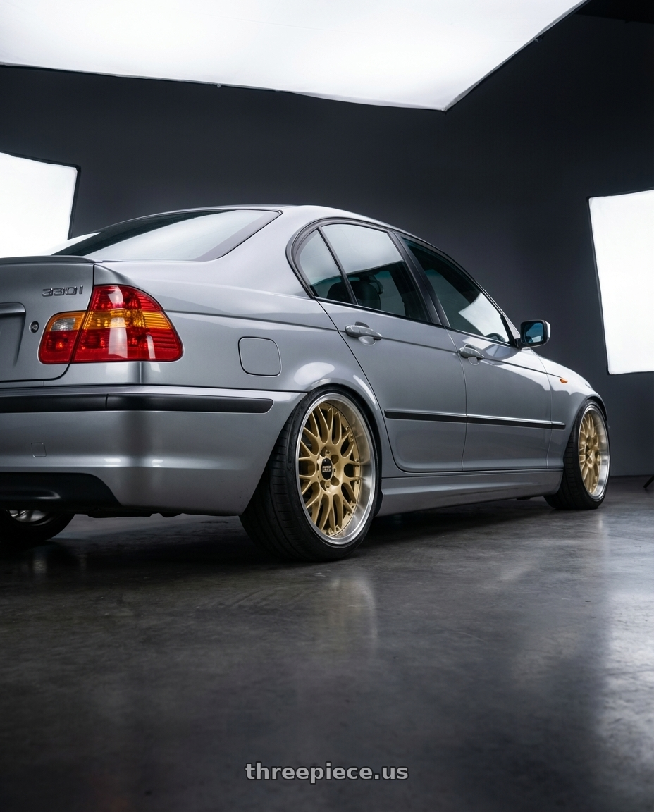 2004 BMW 330i ZHP Silbergrau Metallic with BBS RS-GT 5x130 18x8 +50 Gold w/ Machined Lip wheels rear three quarter view slight stretch tires