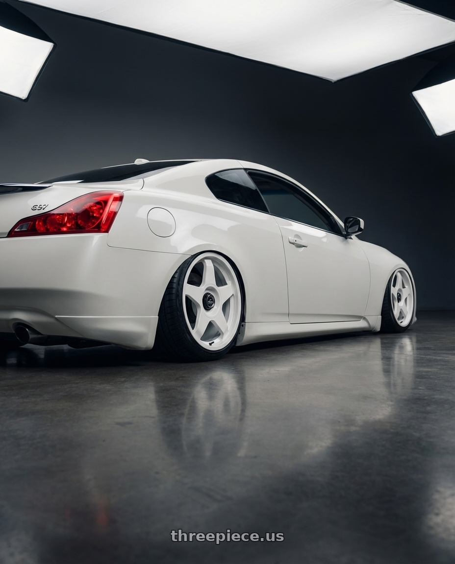 2014 Infiniti G37 Coupe with fifteen52 CHICANE 5x114.3 / 5x120 19x8.5 +35 RALLY WHITE (GLOSS WHITE) wheels rear three quarter view slight stretch tires