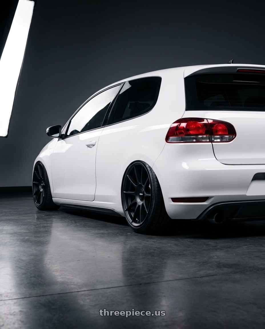2012 VW GTI with Rotiform DTM 5x112 19x8.5 +35 Satin Black wheels rear three quarter view extreme stretch tires