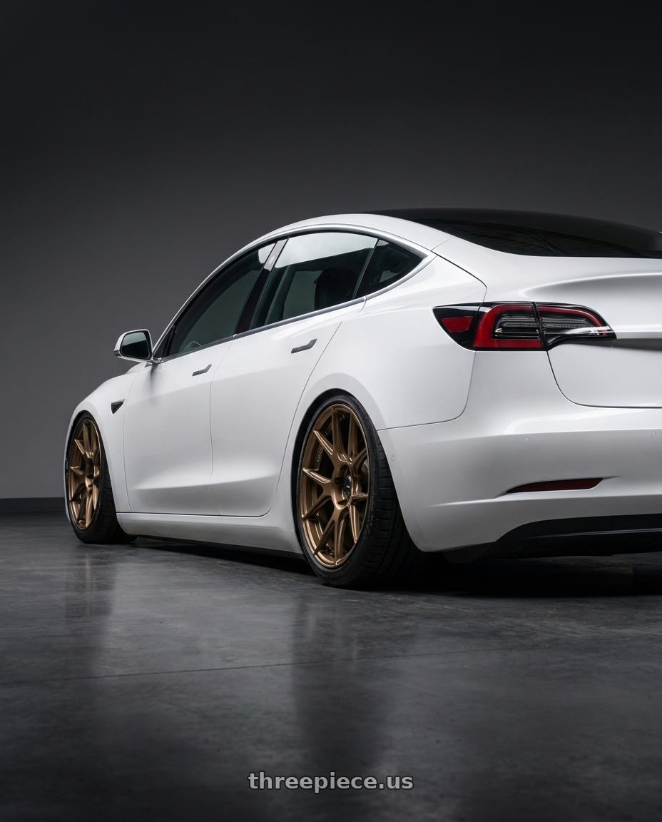 2023 Tesla Model 3 with Konig Ampliform 5x114.3 19x9.5+25 Gloss Bronze wheels rear three quarter view slight stretch tires