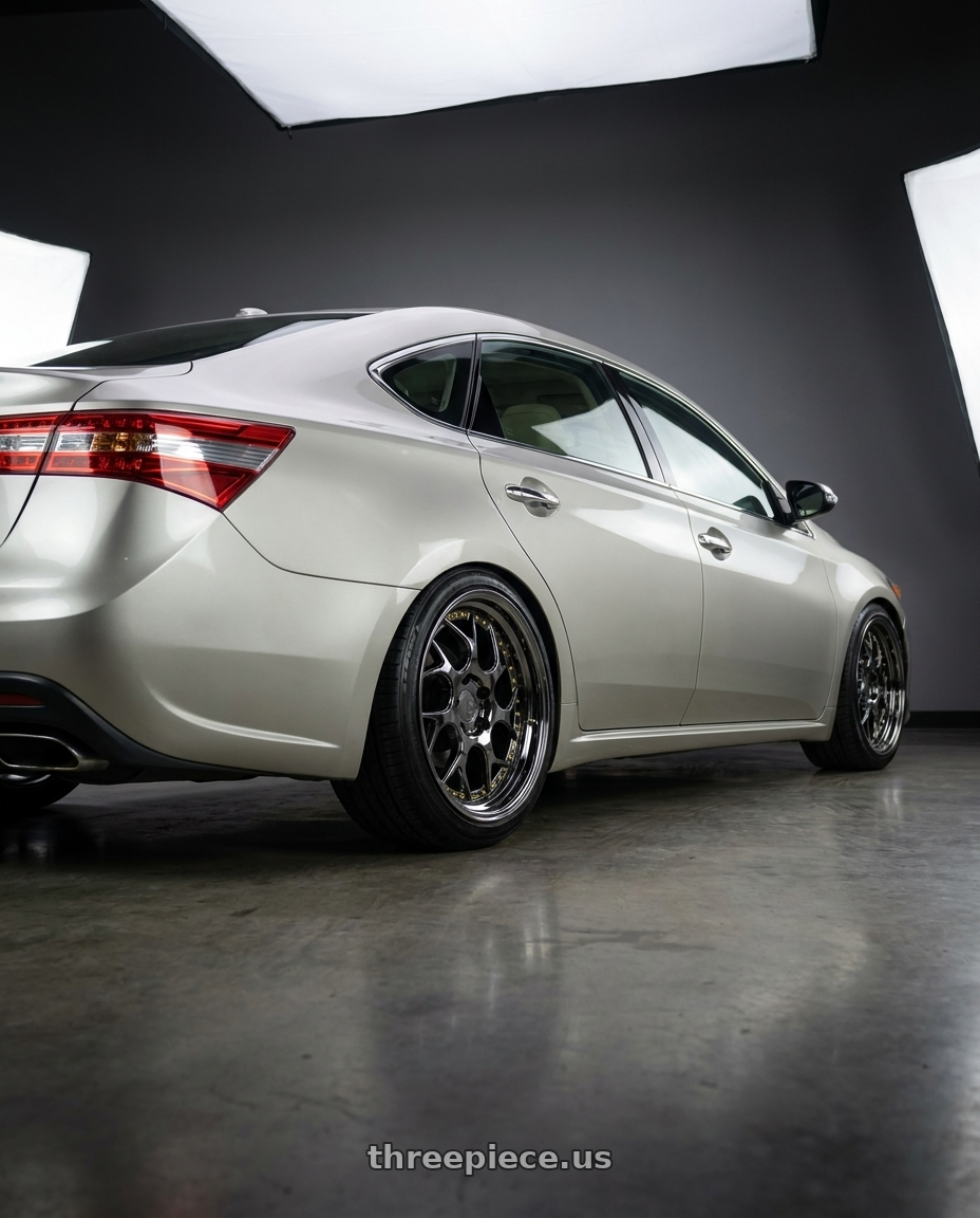 2013 toyota avalon with Aodhan DS01 5x114.3 18x8.5+35 Black Vacuum W/ Gold Rivets wheels rear three quarter view slight stretch tires