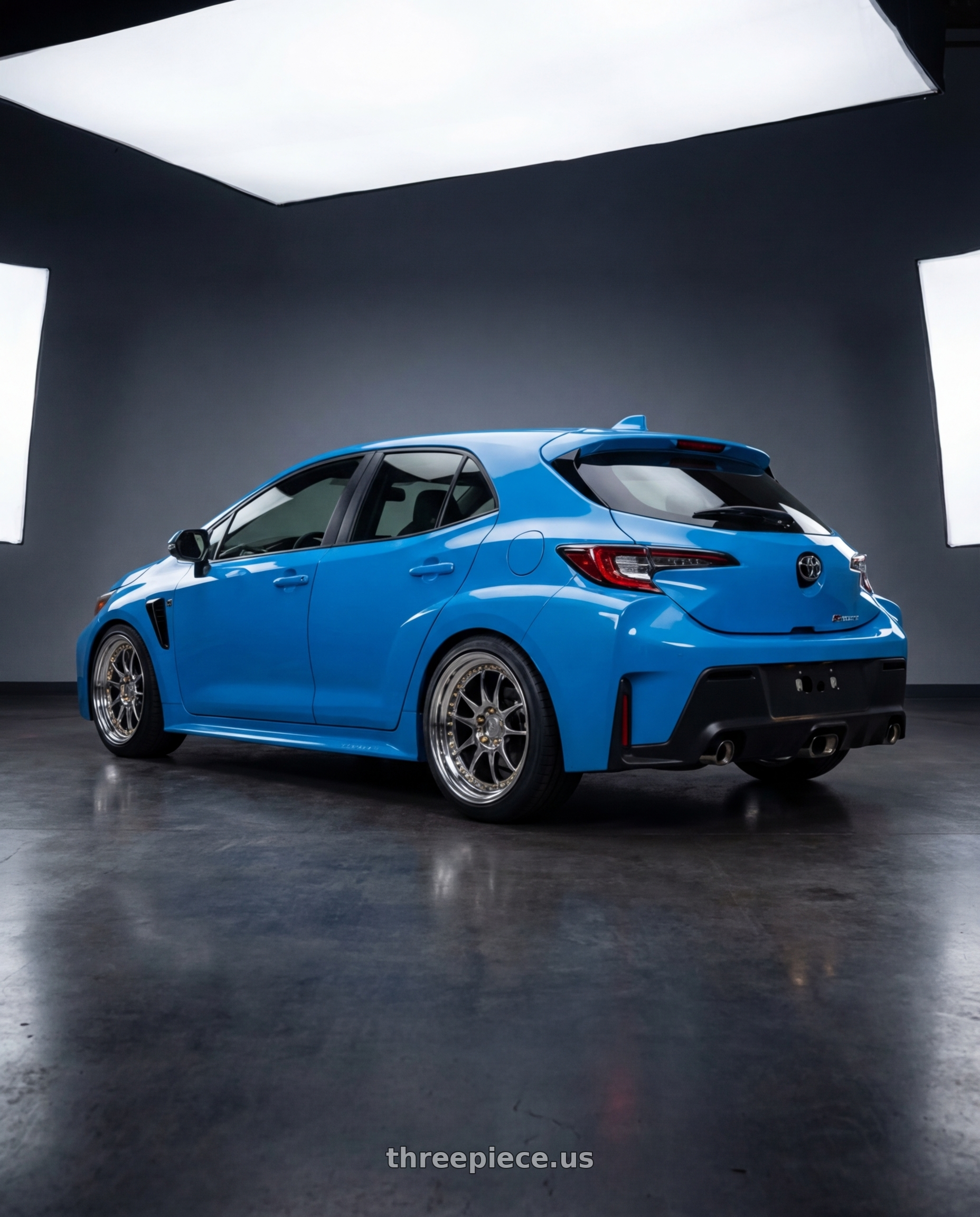 2024 Toyota GR Corolla with Aodhan DS03 5x114.3 18x9.5 +30 Vacuum Chrome w/Gold Rivets wheels rear three quarter view square tires