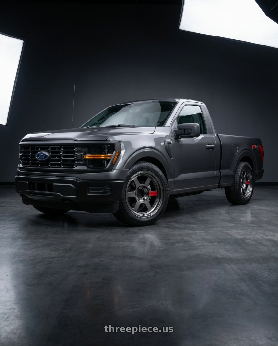 2026 ford f150 with Volk Racing TE37XT SL M-Spec 6x139.7 18x9.0 0 Pressed Graphite wheels front three quarter view lowered stance