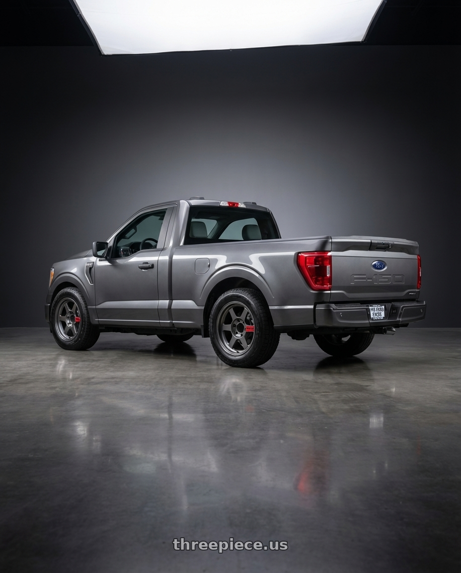 2026 ford f150 with Volk Racing TE37XT SL M-Spec 6x139.7 18x9.0 0 Pressed Graphite wheels rear three quarter view square tires