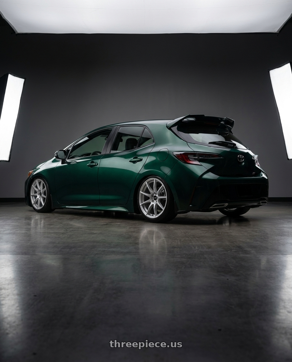 2019 Corolla hatch se with spoiler wrapped dark emerald green with Enkei TS9 5x100 17x9+45 Silver Paint wheels rear three quarter view slight stretch tires