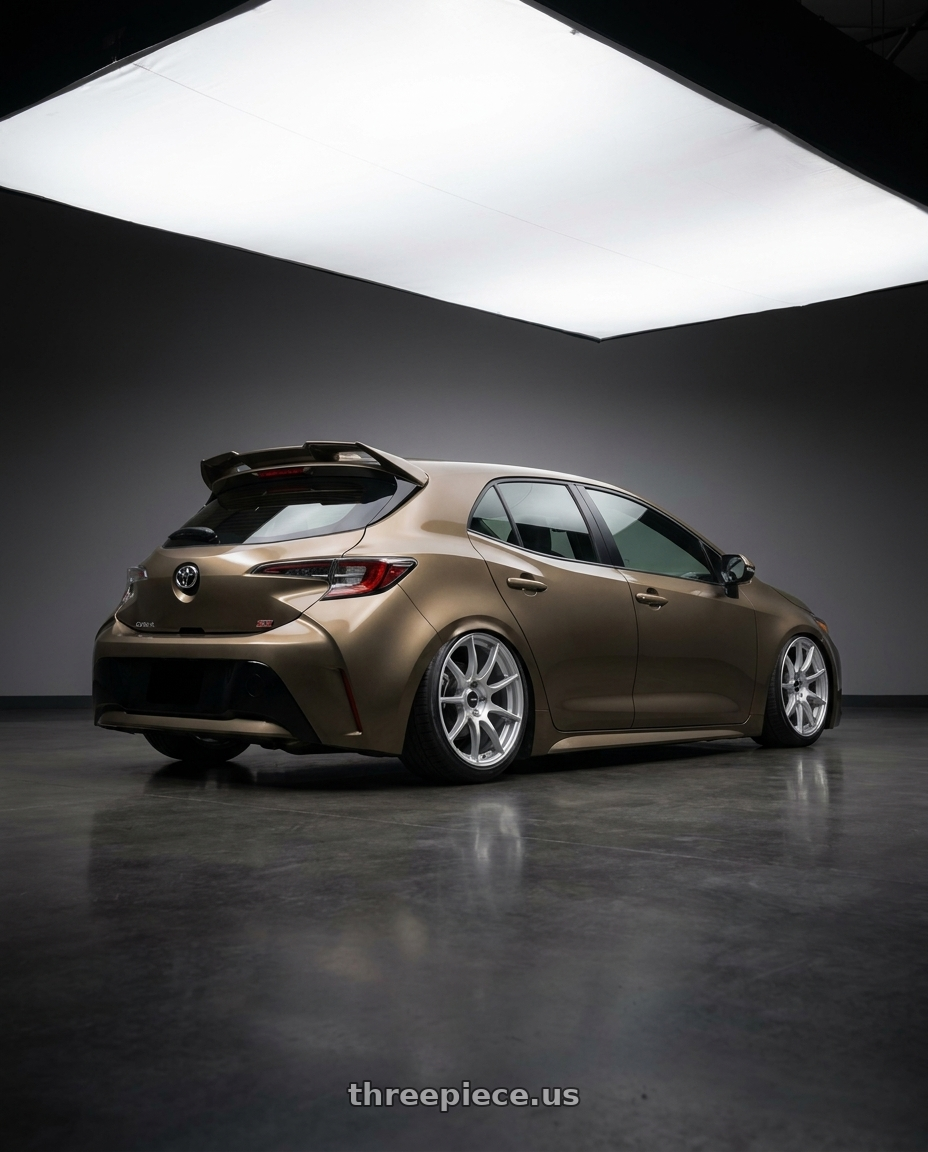 2019 Corolla hatch se oxidize bronze with spoiler with Enkei TS9 5x100 17x9+45 Silver Paint wheels rear three quarter view slight stretch tires
