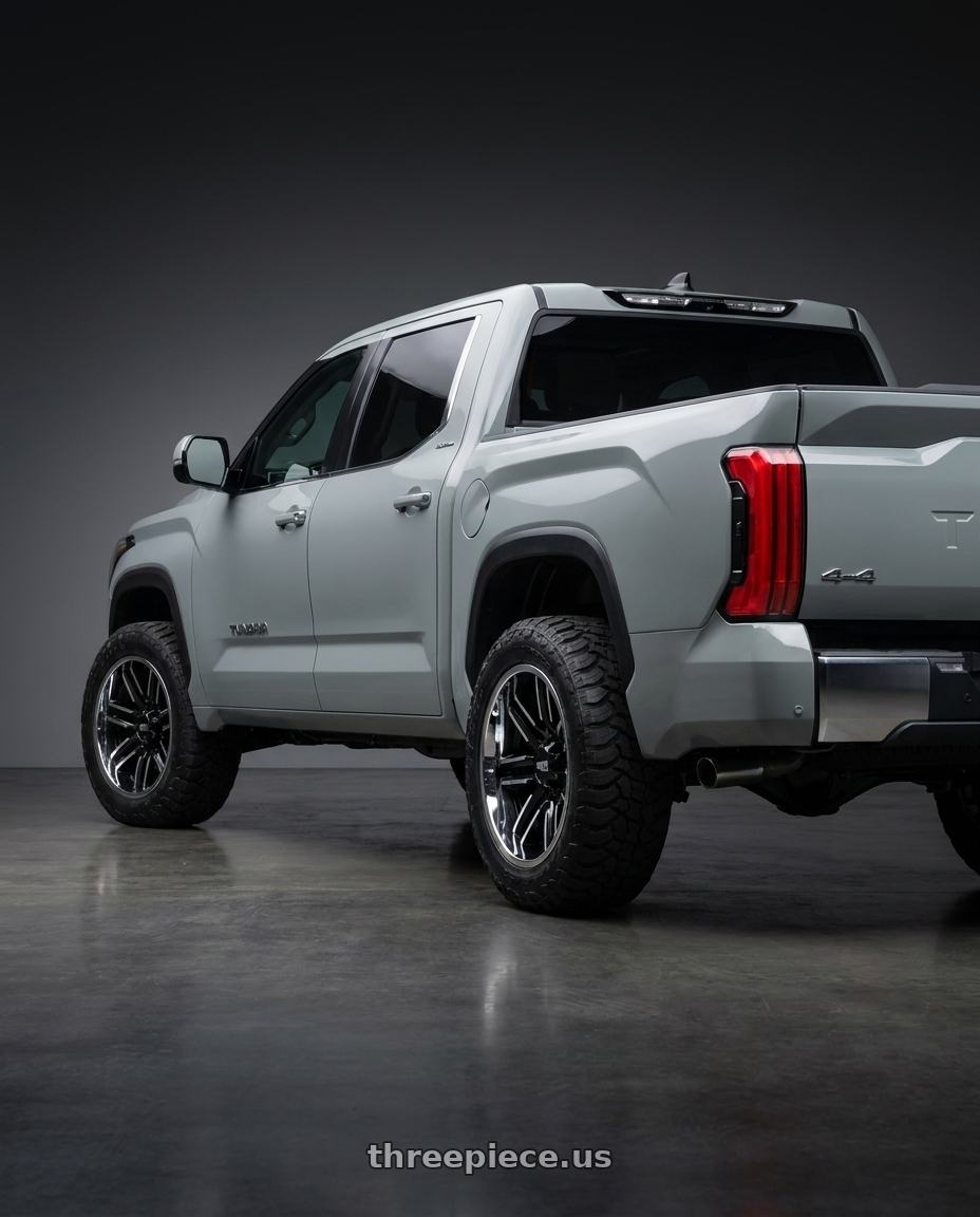 2024 Toyota Tundra with Moto Metal MO202 6X139.7 20X10 -18 GLOSS BLACK MACHINED CENTER CHROME LIP wheels rear three quarter view meaty tires