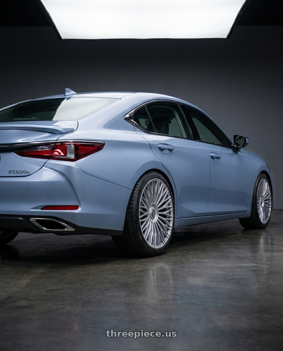 2027 LEXUS ES500e with TIS Motorsports 507S 6X135 28x10 24 Gloss Silver wheels rear three quarter view slight stretch tires