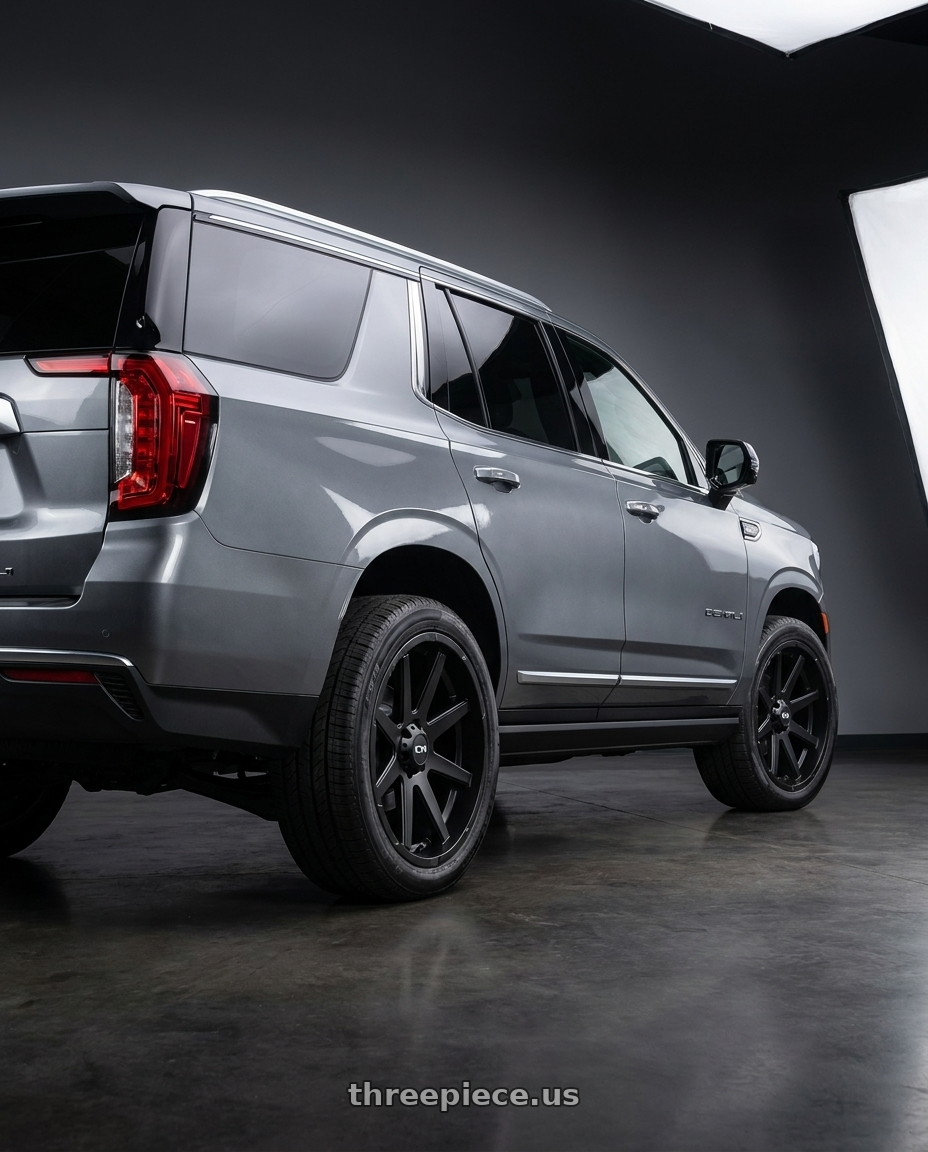 2021 GMC Yukon Denali with Ion Type 143 6x139.7 20x9+18 Matte Black wheels rear three quarter view square tires