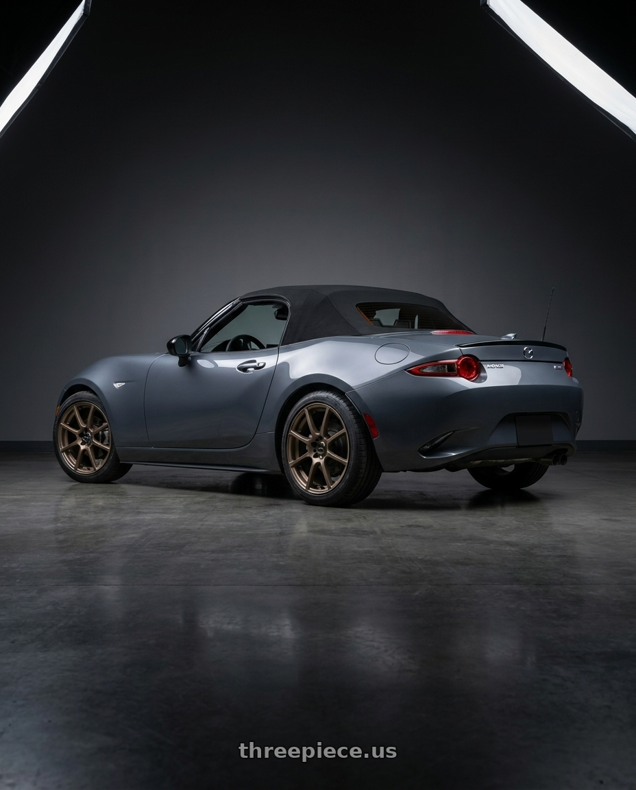 2020 Mazda mx-5 Miata club soft top polymetal grey with Focal 448BZ F-20 4X100/4X108 16x7 +40 Dark Satin Bronze wheels rear three quarter view square tires