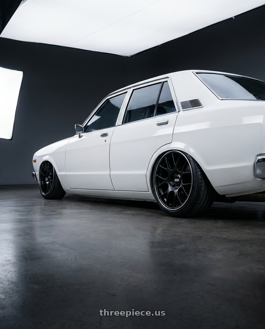 1977 Datsun Stanza with BBS CH-R 5x130 19x12 +45 Satin Black Polished Rim Protector wheels rear three quarter view slight stretch tires