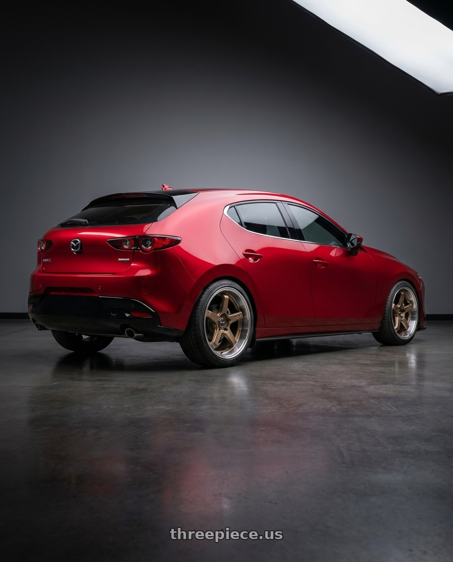 2026 Mazda 3 hatchback soul red with F1R FC5 5x114 18x8.5 +38 Satin Bronze/Polish Lip wheels rear three quarter view square tires