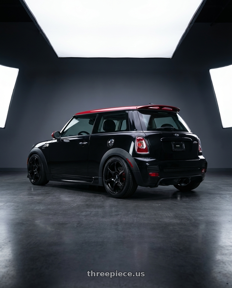 2013 mini cooper jcw with Advan RGIII 4x100 18x7.0+42 Gloss Black wheels rear three quarter view slight stretch tires