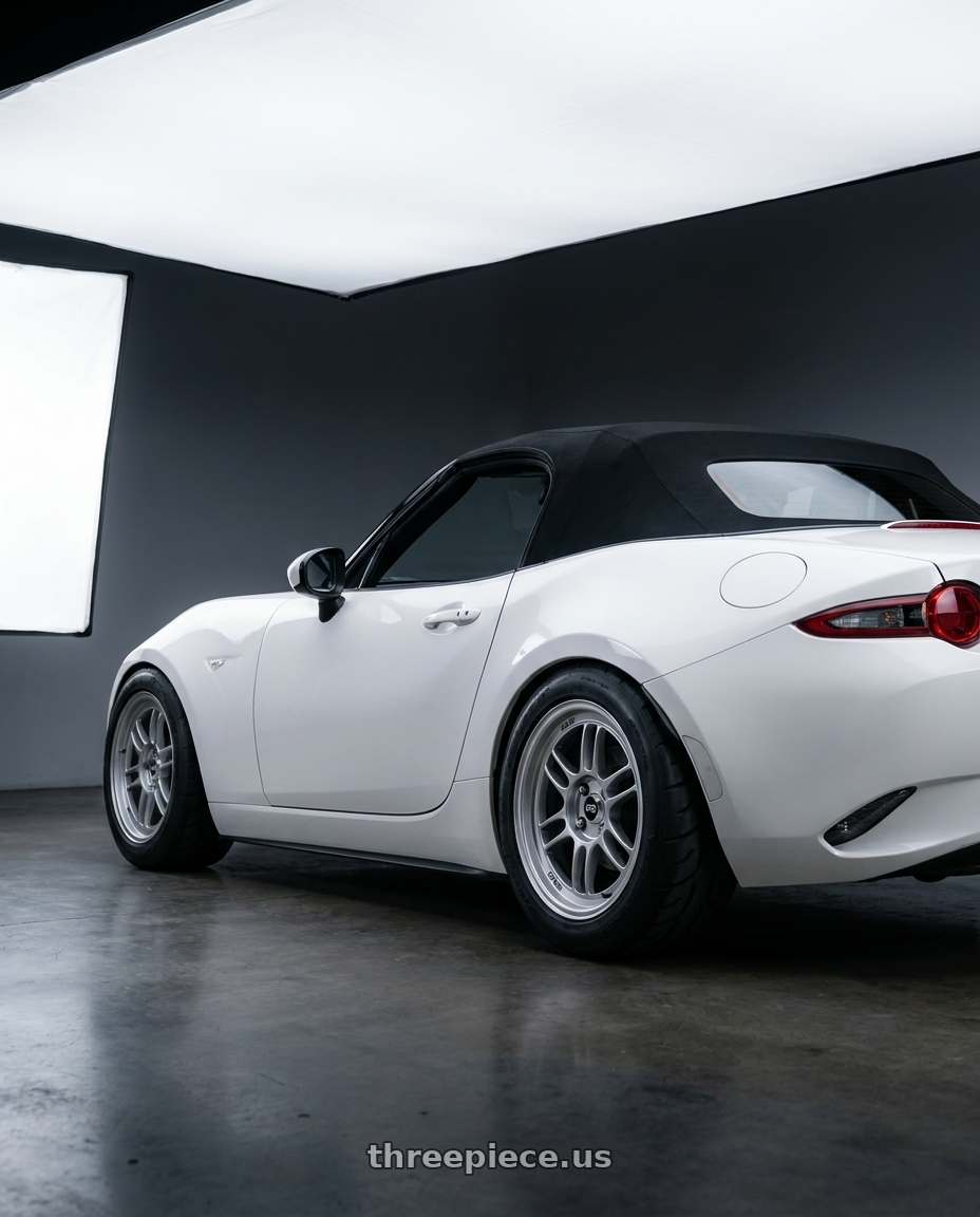 2024 nd mx5 soft top with Enkei RPF1 4x100 15x8+28 Silver wheels rear three quarter view meaty tires