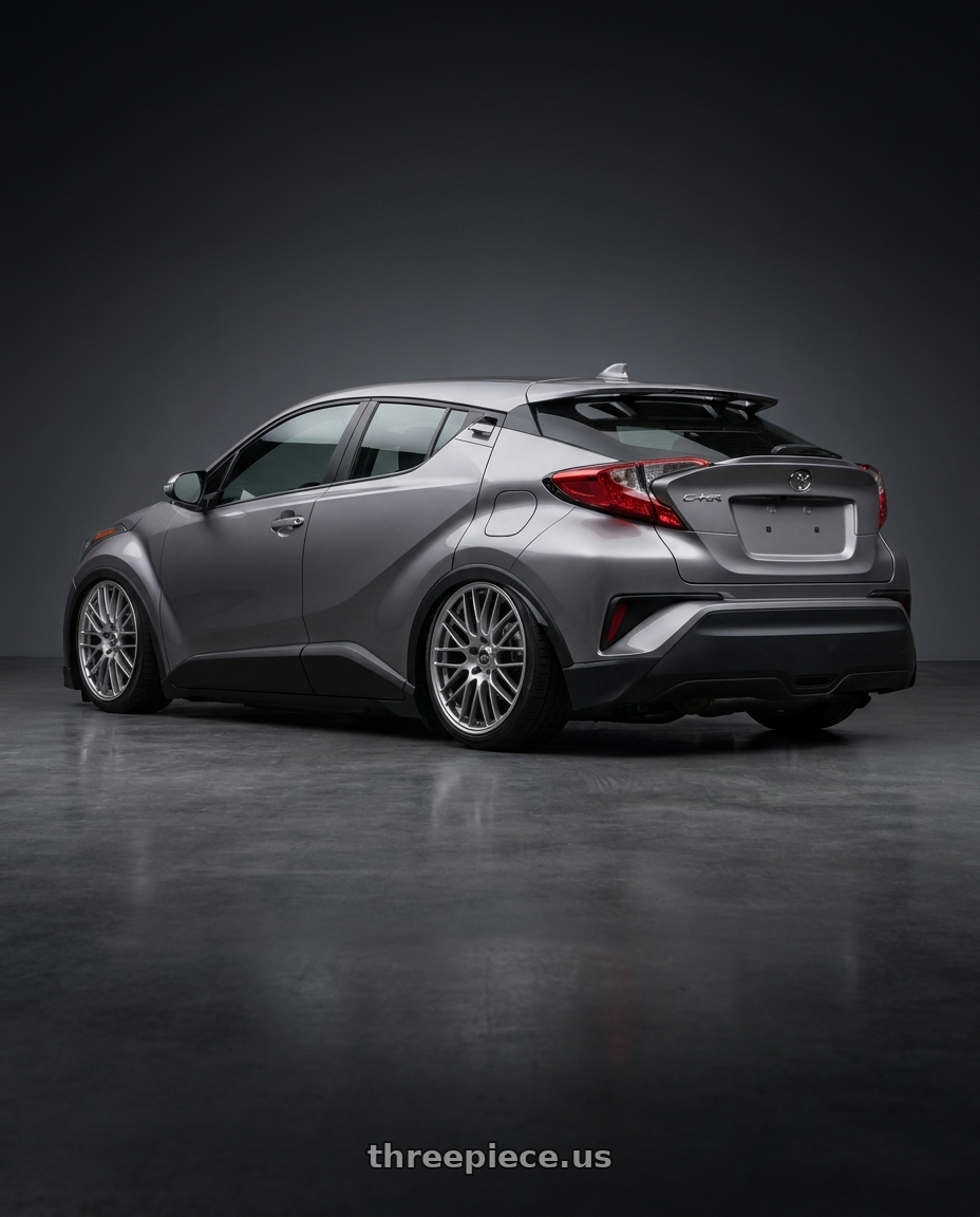 2022 Toyota chr with Enkei EKM3 5x100 17x7+45 72.8 Hyper Silver wheels rear three quarter view slight stretch tires