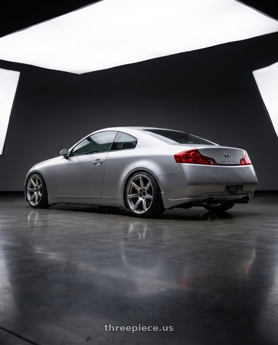 2005 infiniti g35 coupe, silver with Work Emotion T7r 5x100 18x10.5 +32 Gt Silver wheels rear three quarter view slight stretch tires