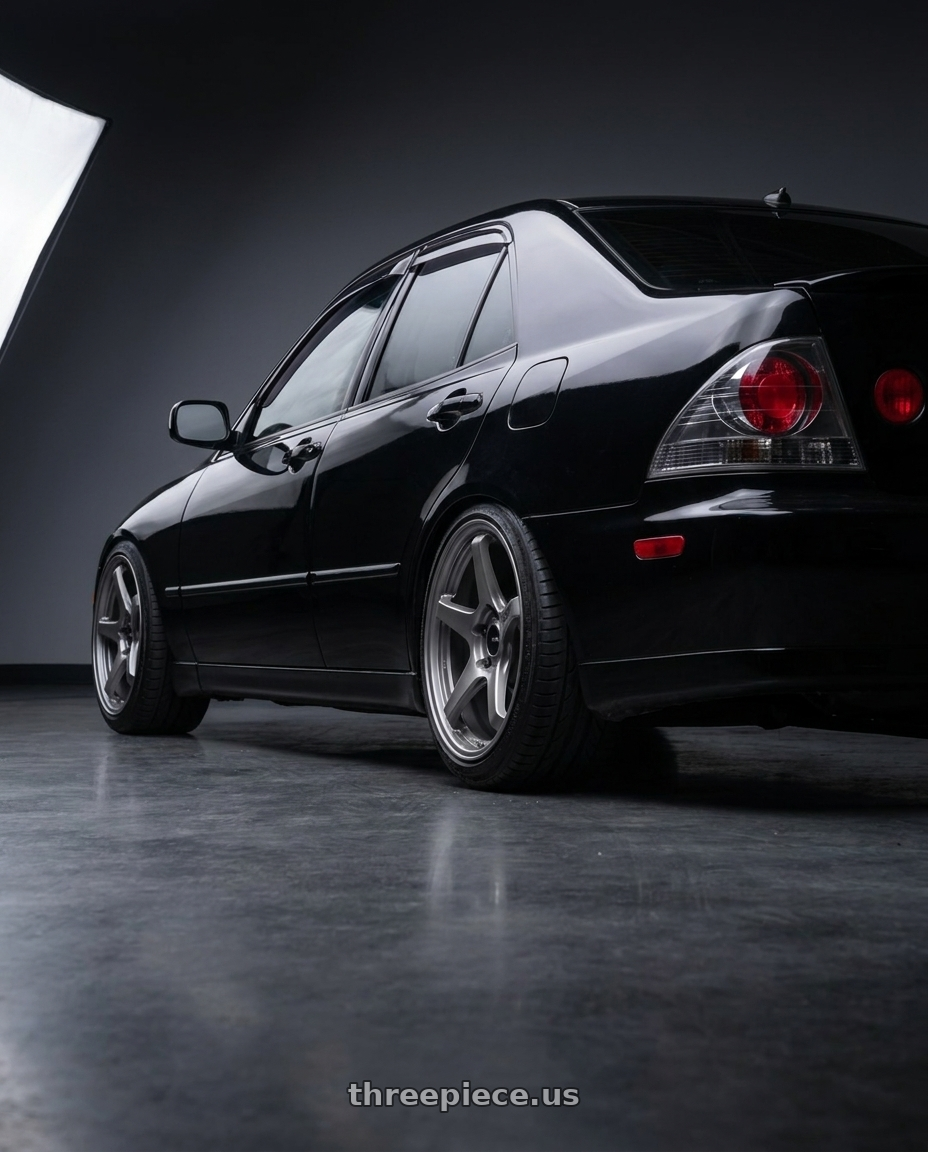 2004 Lexus IS300 with Enkei TS-5 5x114.3 18x9.5+38 Storm Grey wheels rear three quarter view slight stretch tires
