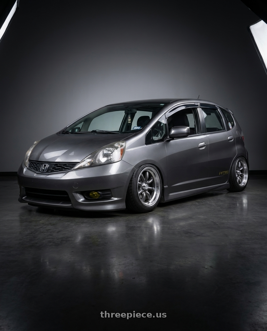 2013 honda fit with Konig Rewind 4x100 15x7+40 Graphite wheels