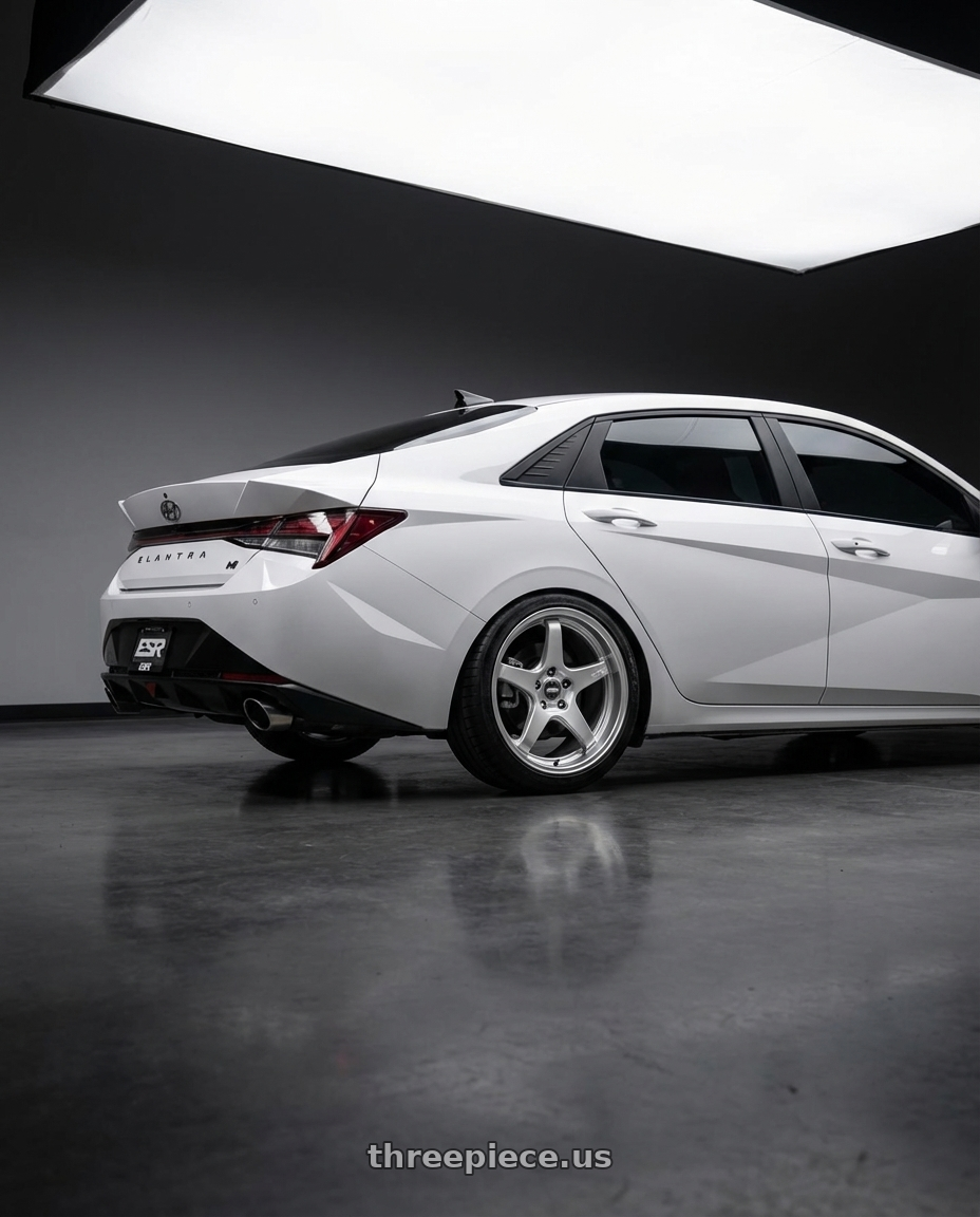 2024 Hyundai Elantra N with ESR Wheels APEX SERIES AP5 5x114.3 19x11 +22 Hyper Silver wheels rear three quarter view square tires
