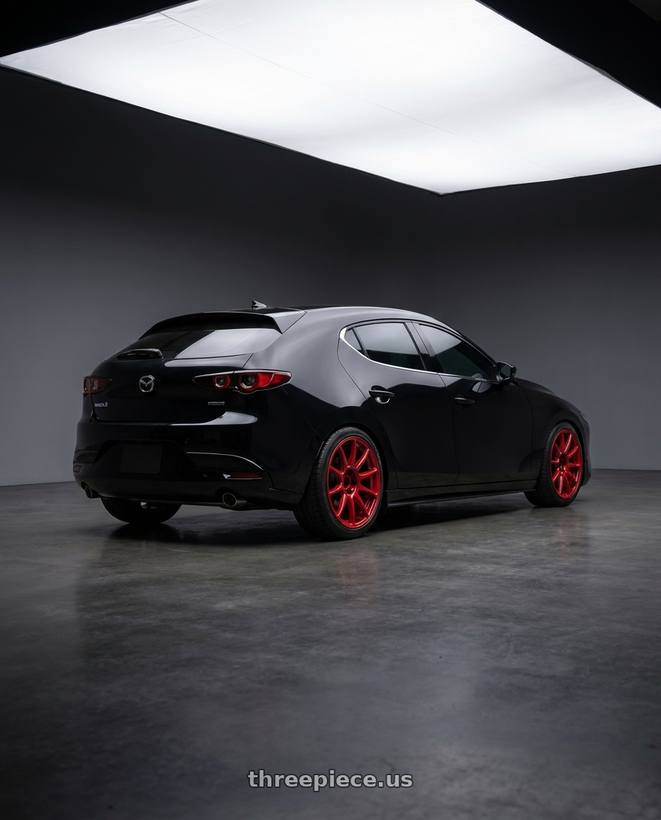 2026 Mazda 3 Hatchback with Work Mco Racing 5x114.3 18x8.5+40  Red wheels rear three quarter view square tires