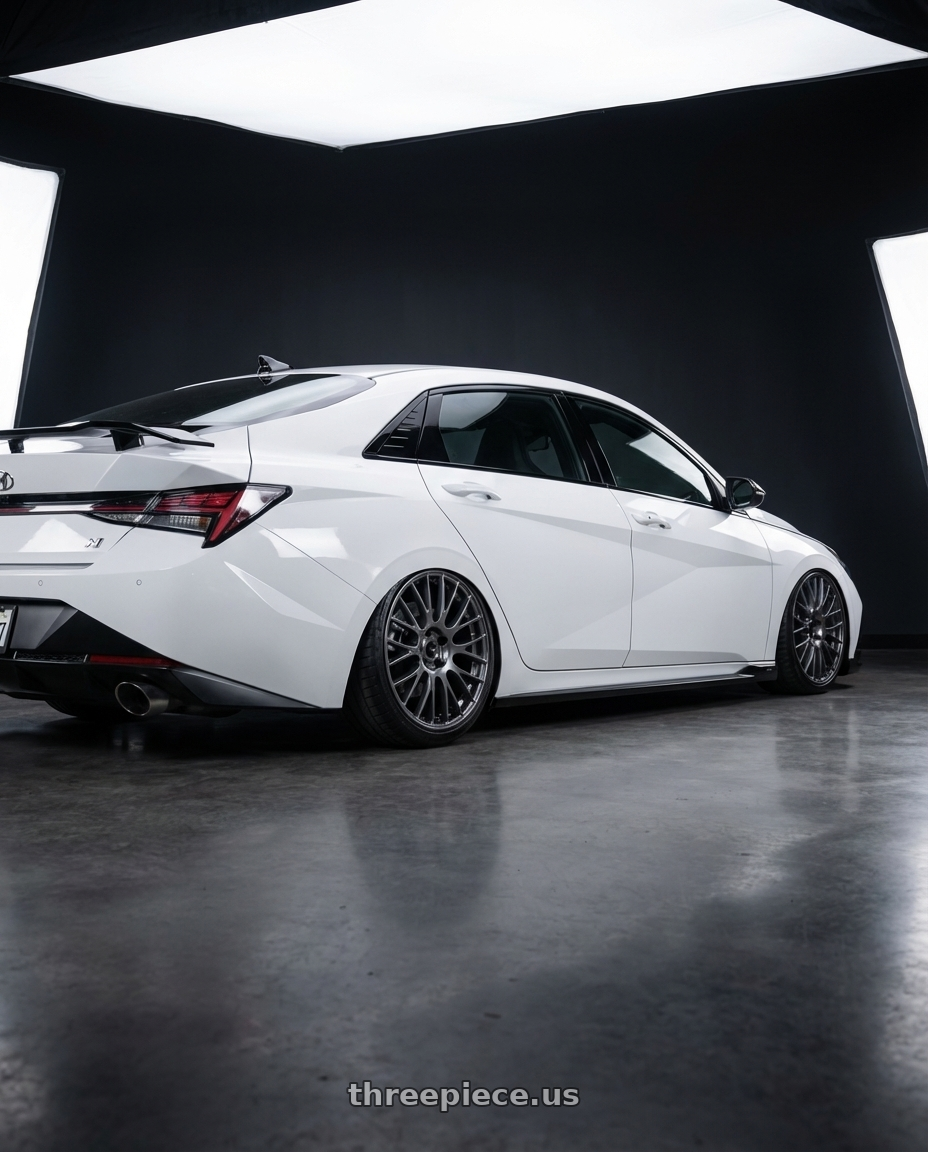 2024 Hyundai Elantra N with Ssr Gtv04 5x114.3 19×8.5x8.5+38  METALLIC GRAY wheels rear three quarter view slight stretch tires