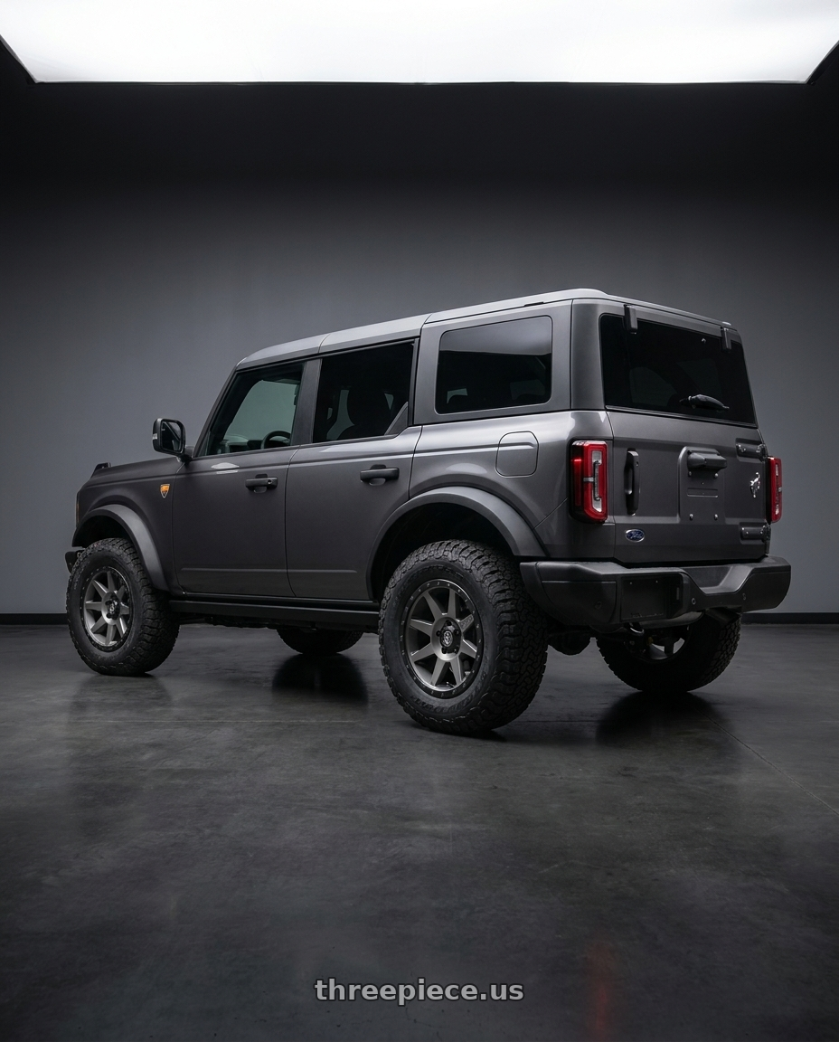 2023 Ford Bronco with Icon Alloys REBOUND 6x139.7 17X8.5+25 TITANIUM wheels rear three quarter view square tires