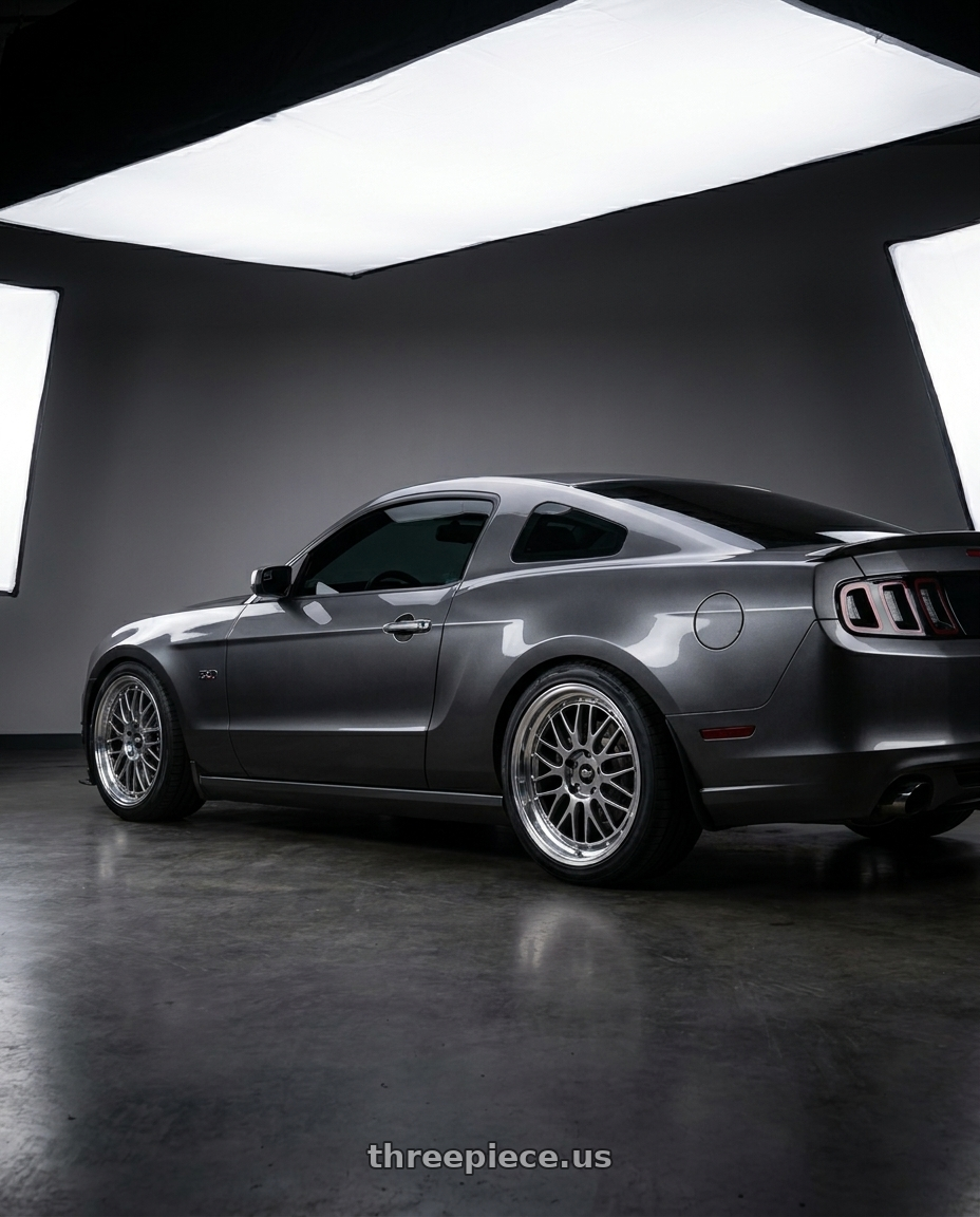 2014 Ford Mustang GT with MST Wheels LeMan 5x114.3 19x9.5 +35 Hyper Black w/Machined Lip wheels rear three quarter view square tires