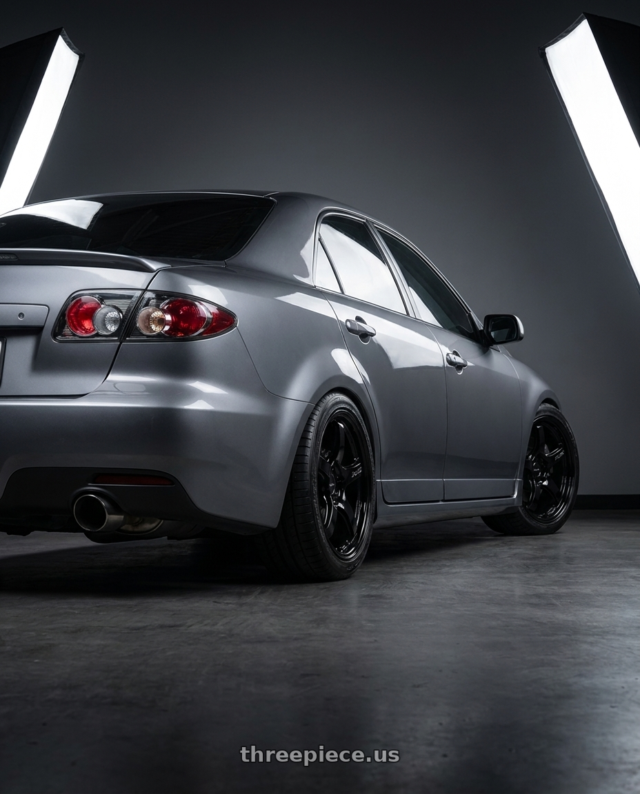 2006 Mazda Speed6 with Gram Lights 57CR 5x100 18x7.5+50 Glossy Black wheels rear three quarter view square tires