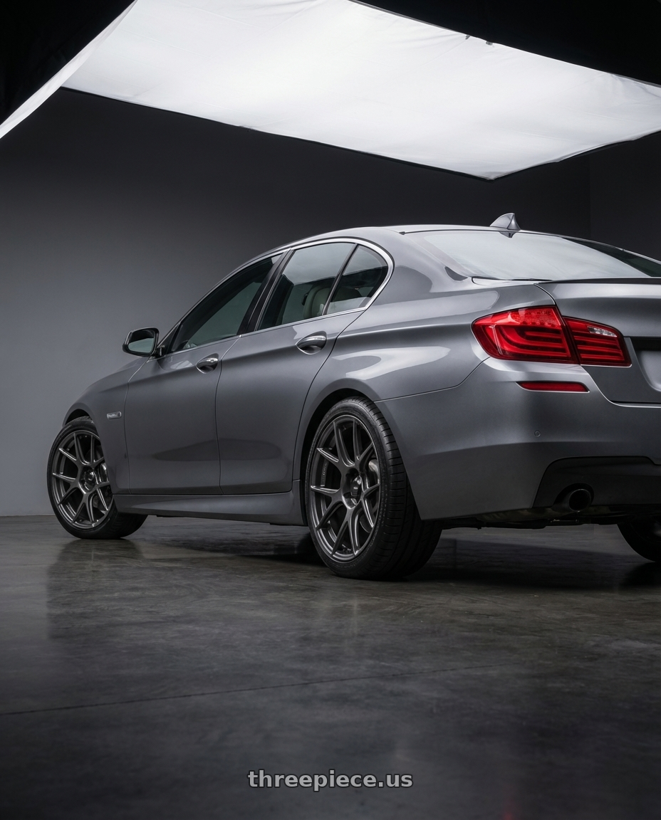 2016 BMW 5 Series F10 with Konig Ampliform 5x120 19x8.5+32 Dark Metallic Graphite wheels rear three quarter view square tires