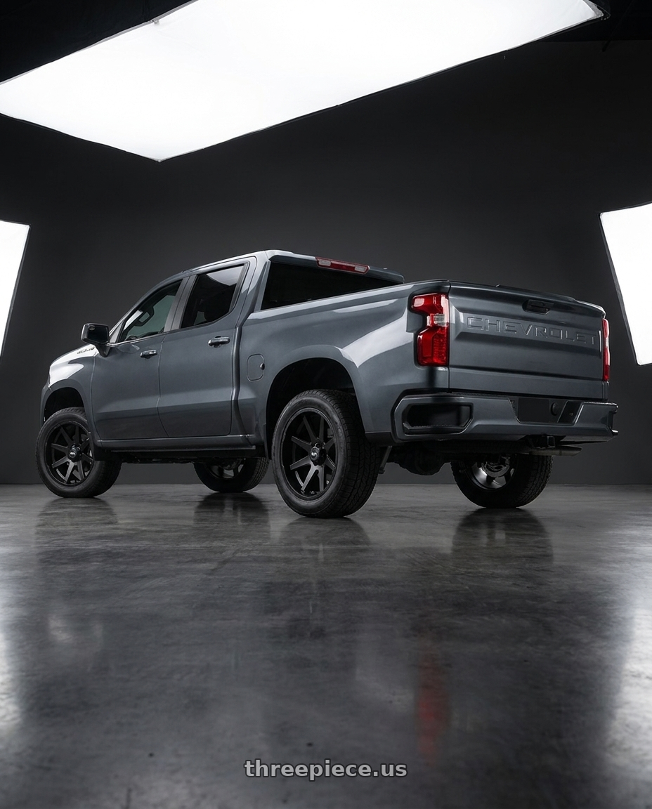 2021 Chevrolet Silverado 1500 LT with Ion Type 143 6x139.7 20x9+18 Matte Black wheels rear three quarter view square tires