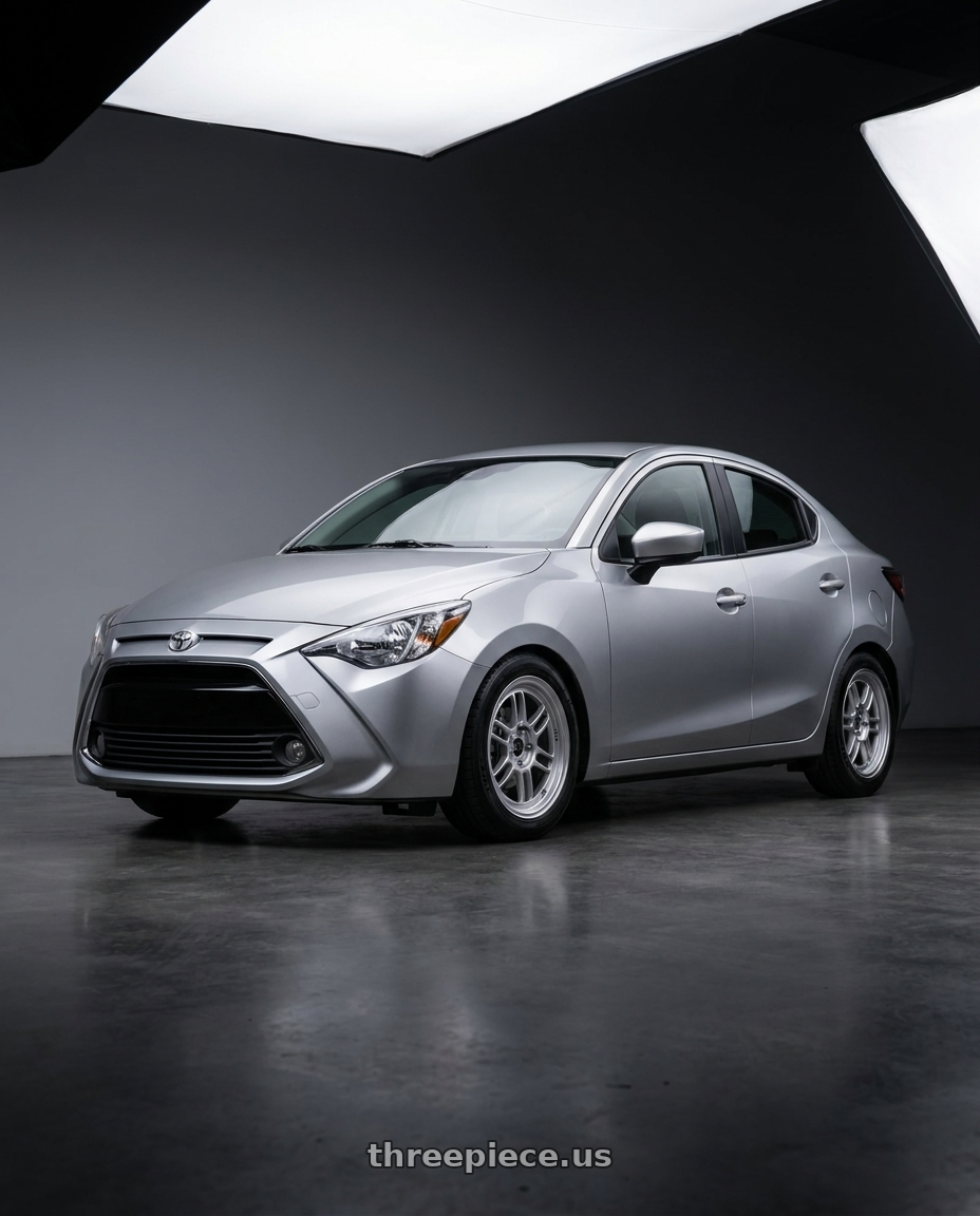 2016 Toyota Yaris sedan with Enkei RPF1 4x100 15x7+41 Silver wheels
