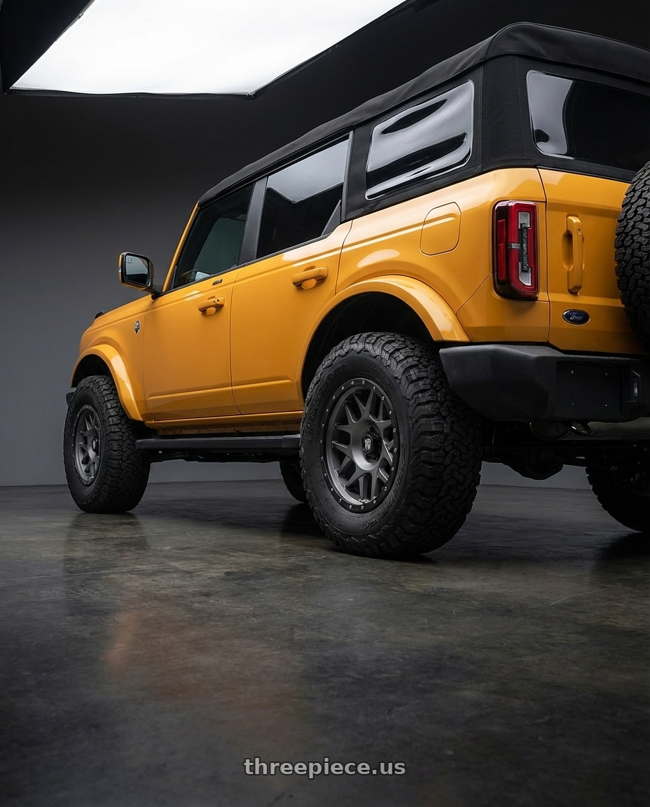 2024 Ford Bronco with XD XD127 BULLY 6X139.7 17X9 -12 MATTE GRAY BLACK RING wheels rear three quarter view meaty tires