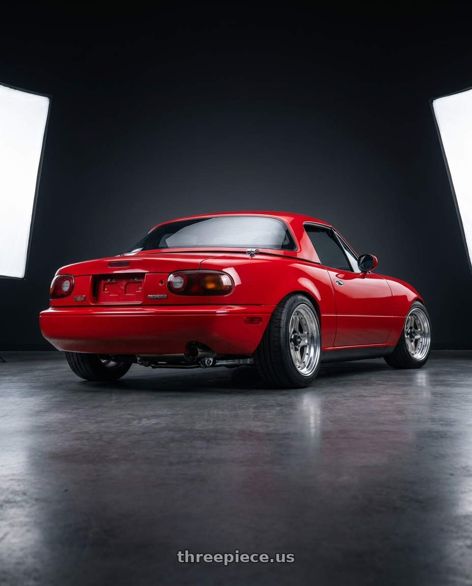 1991 Mazda Miata with Work Equip 40 4x100 15x8 +22 a disk Brut Silver wheels rear three quarter view square tires