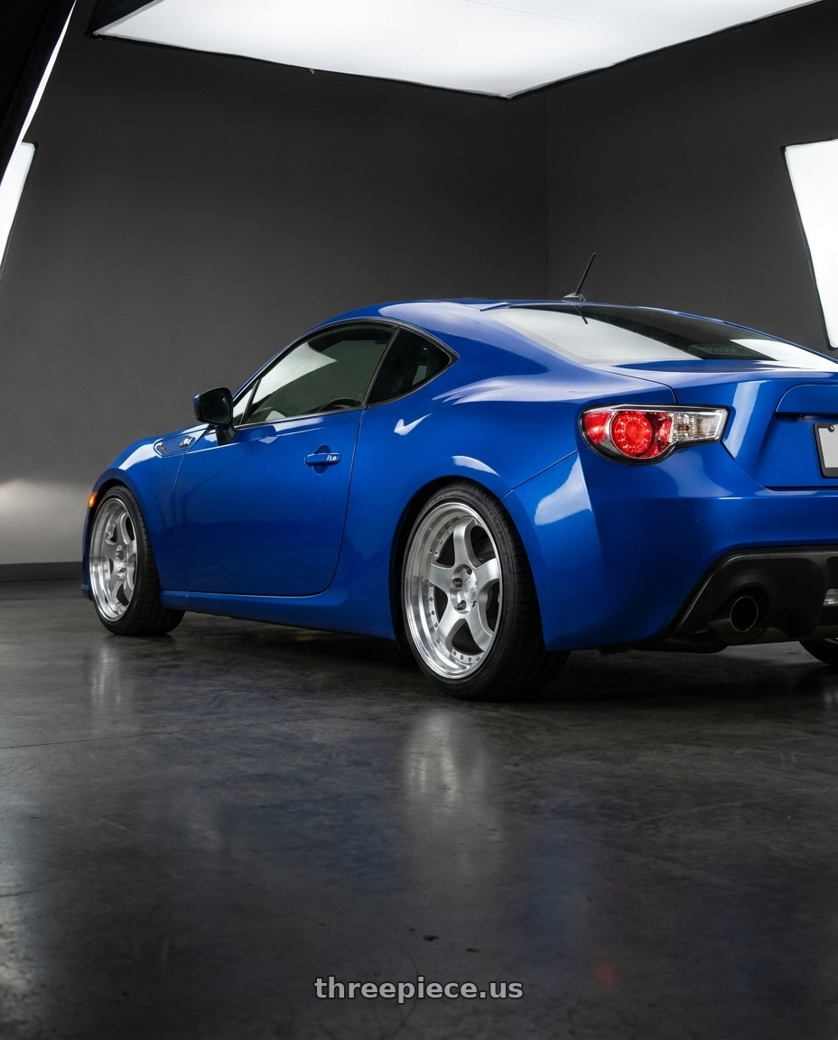 2013 Subaru BRZ with Aodhan AH03 5x100 18x9.5+35 Silver w/Machined Face wheels rear three quarter view square tires