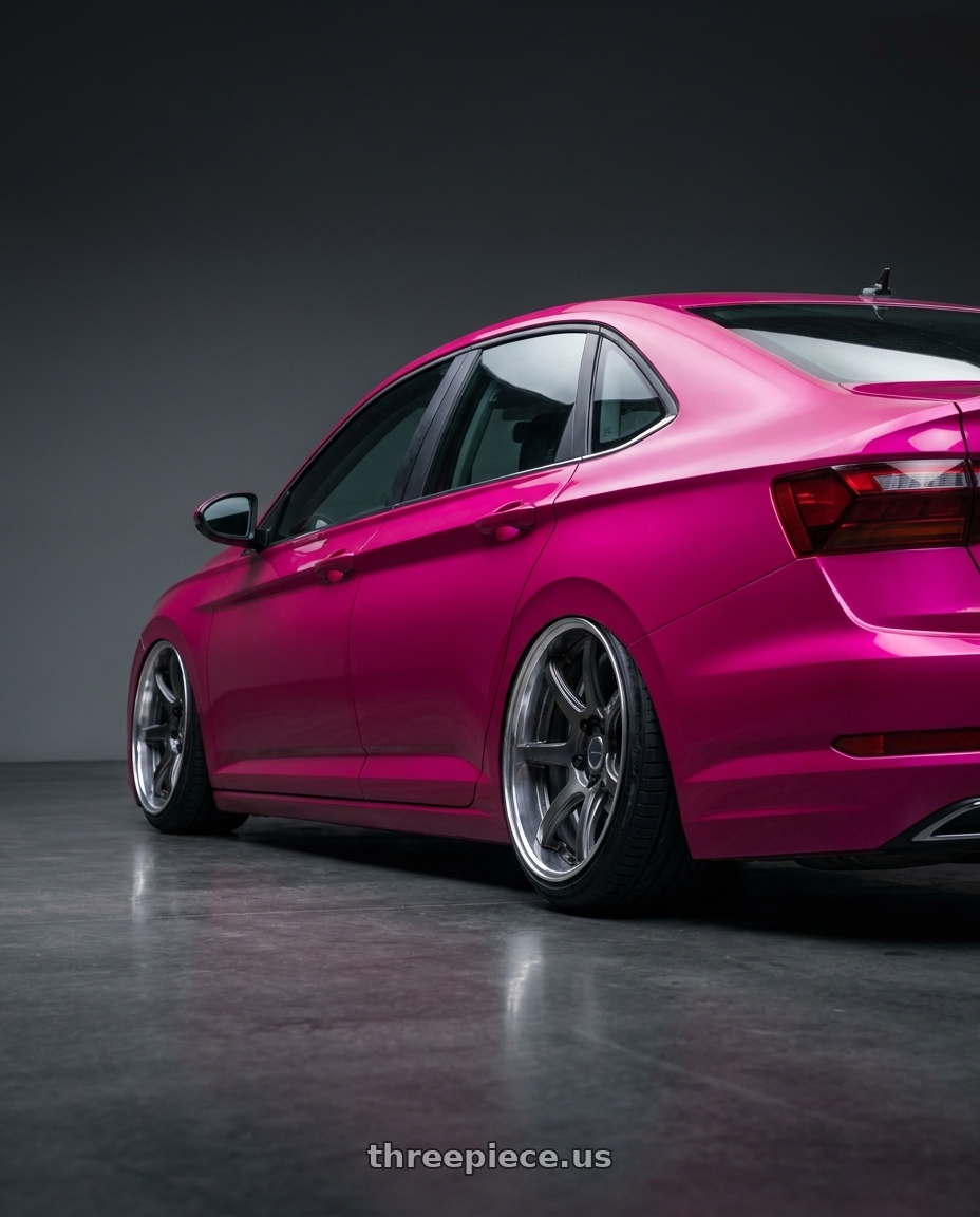 2019 vw jetta pink with Work Emotion T7R 2P wheels rear three quarter view extreme stretch tires