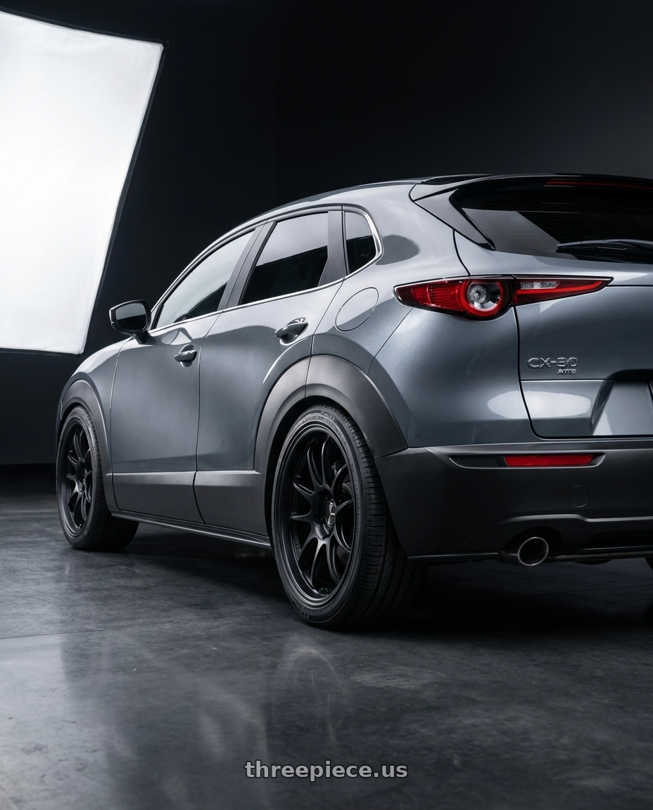 2026 Mazda cx30 with Enkei PF01EVO 5x114.3 18x9.5+0 Matte Black wheels rear three quarter view square tires