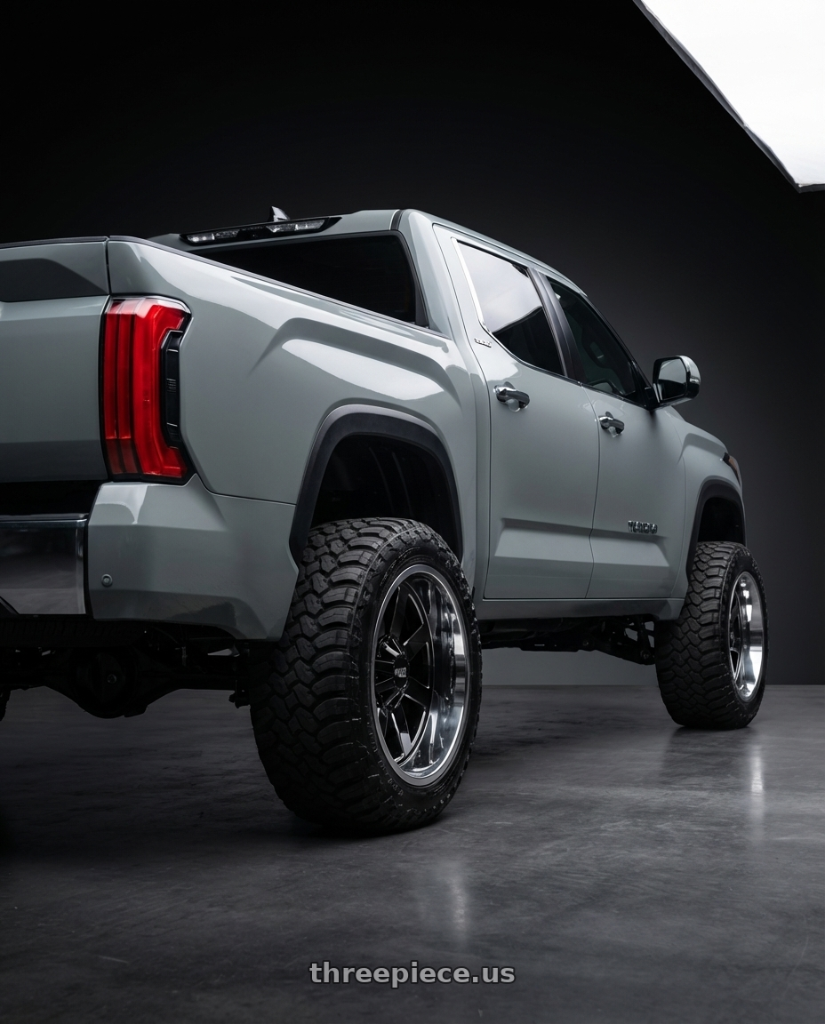 2024 Toyota Tundra with Moto Metal MO200 6X139.7 22X10 -18 GLOSS BLACK MILLED CENTER CHROME LIP wheels rear three quarter view meaty tires