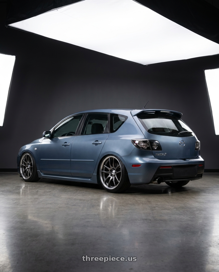 2007 mazda mazdaspeed3 with Work Emotion CR2P wheels rear three quarter view slight stretch tires