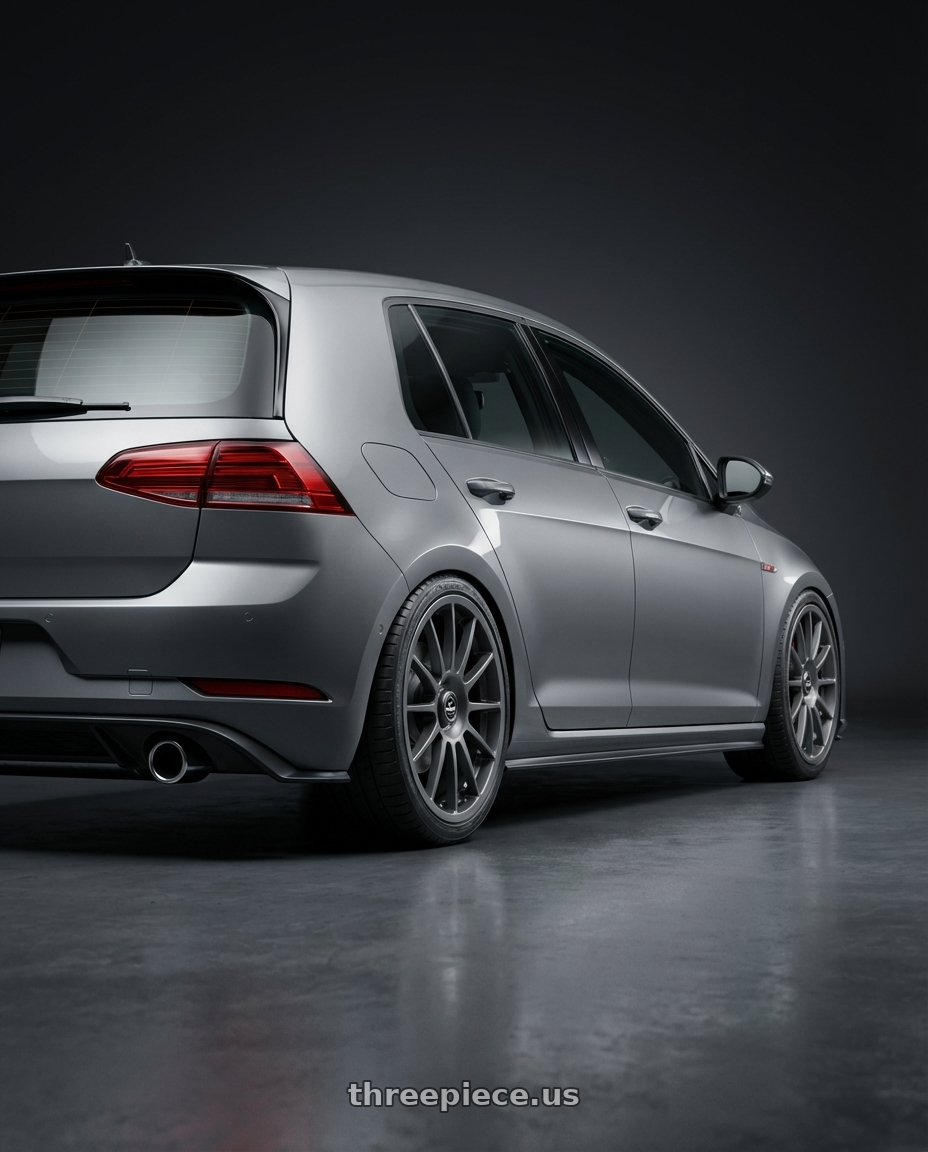 2019 Volkswagen GTI MK7 with fifteen52 PODIUM 5x112 / 5x120 18x8.5 +35 FROSTED GRAPHITE (SATIN GREY) wheels rear three quarter view square tires
