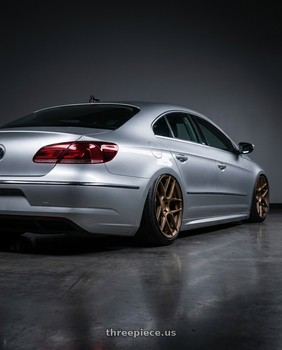 2015 Volkswagen CC with Aodhan AFF2 5x112 19x9.5+35 Matte Bronze wheels rear three quarter view slight stretch tires