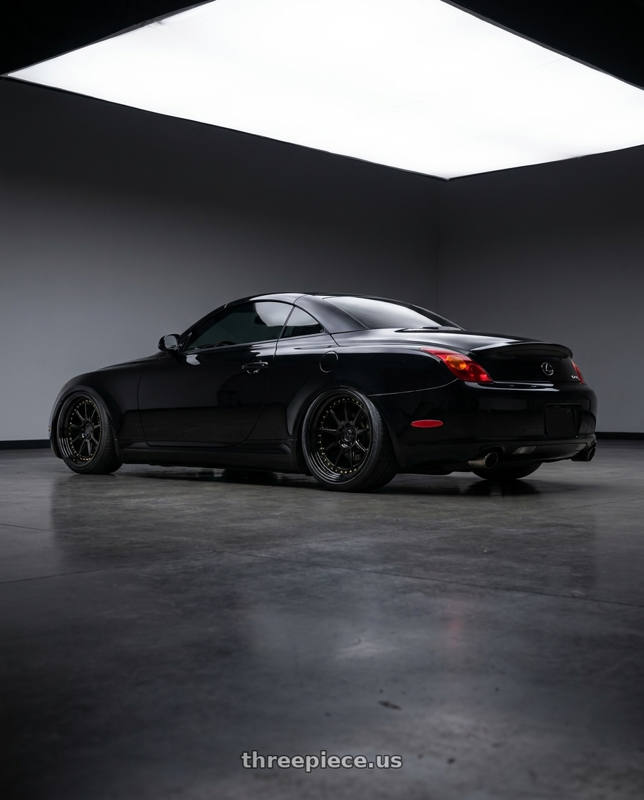 2005 lexus sc430 with Aodhan DS-X 5x114.3 18x9.5 +15 Gloss Black W /Gold Rivets wheels rear three quarter view square tires