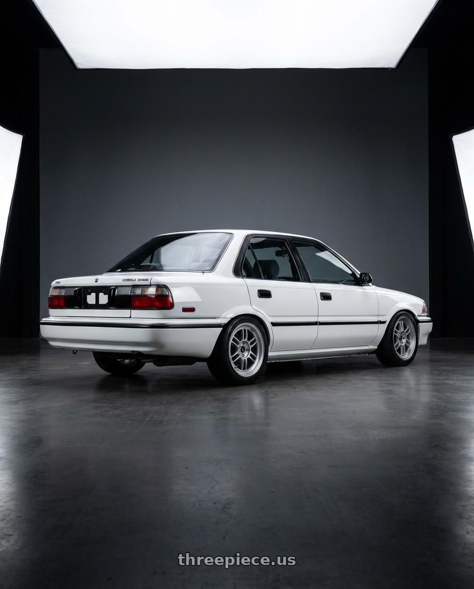 1990 Toyota Corolla with Enkei RPF1 4x100 15x7+35 Silver wheels rear three quarter view square tires