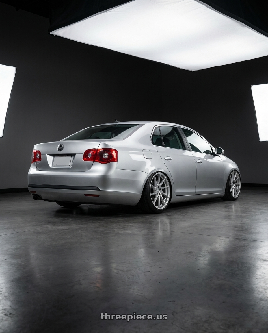 2009 Volkswagen Jetta GLI MK5 with Aodhan AH09 5x112 18x9.5 +35 Gloss Silver Machined Face wheels rear three quarter view slight stretch tires